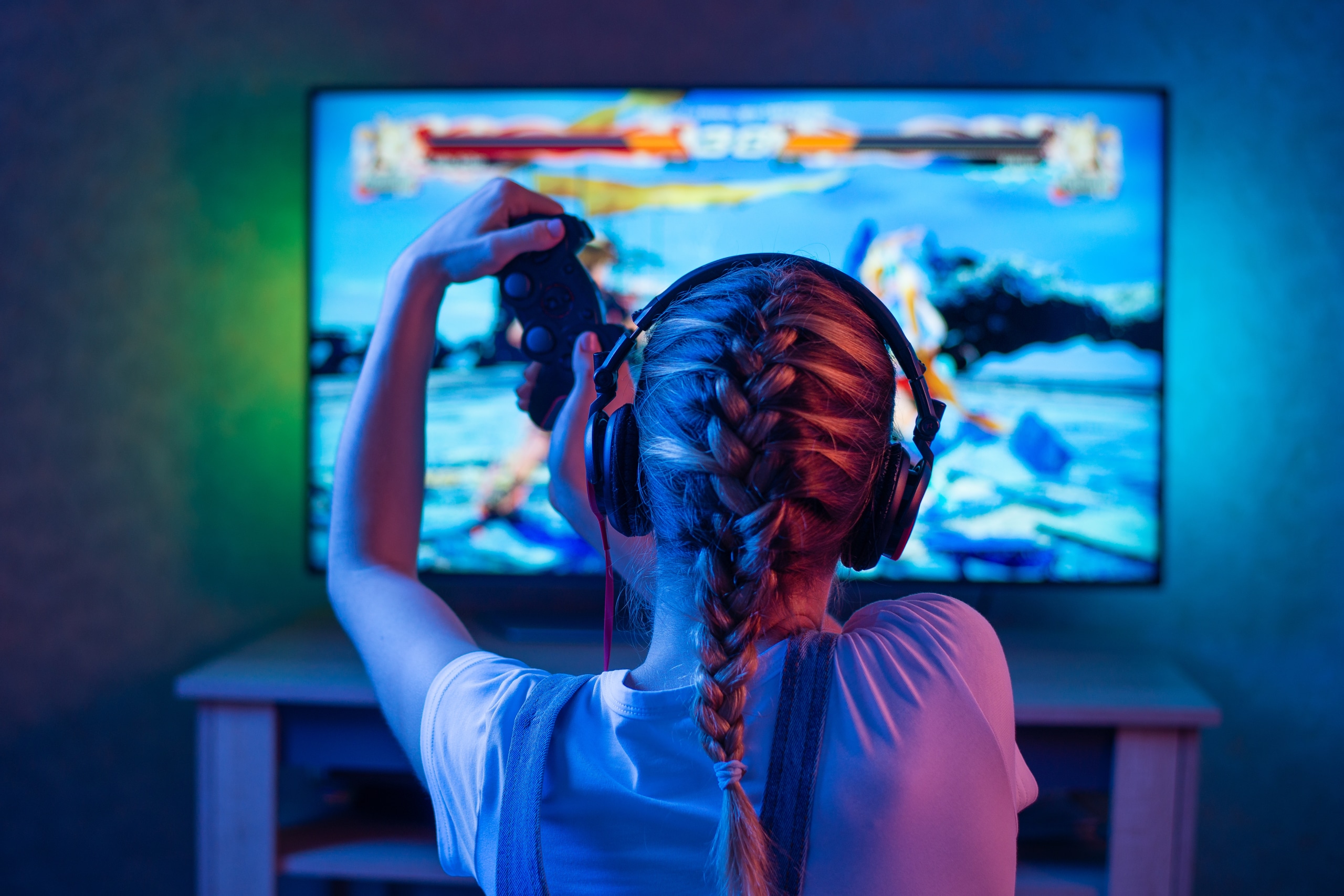 A young girl plays an online video game on a home network.
