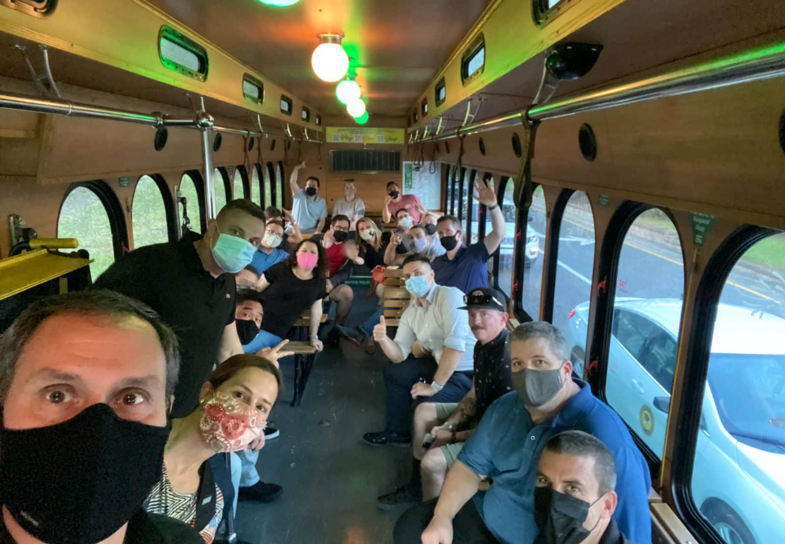 BlackCloak team riding a streetcar
