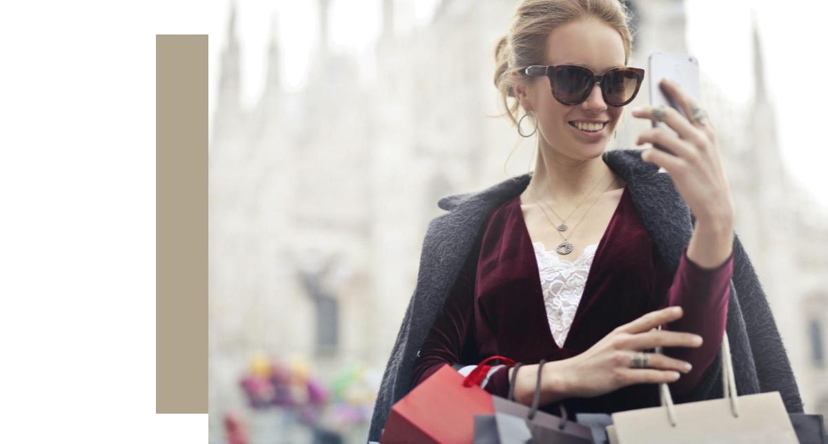 lady on sunglasses looking at a phone