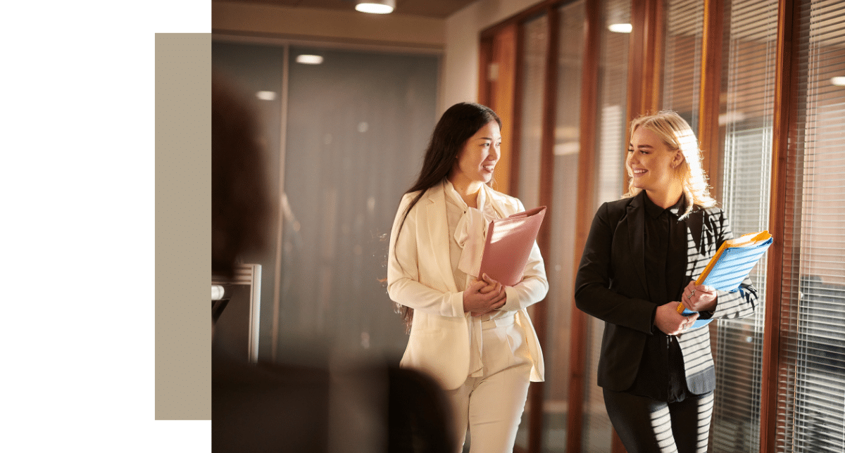 women walking with folders