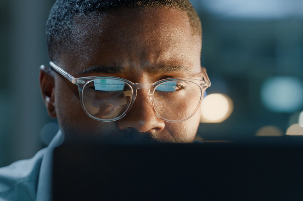 A BlackCloak analyst monitoring at a screen