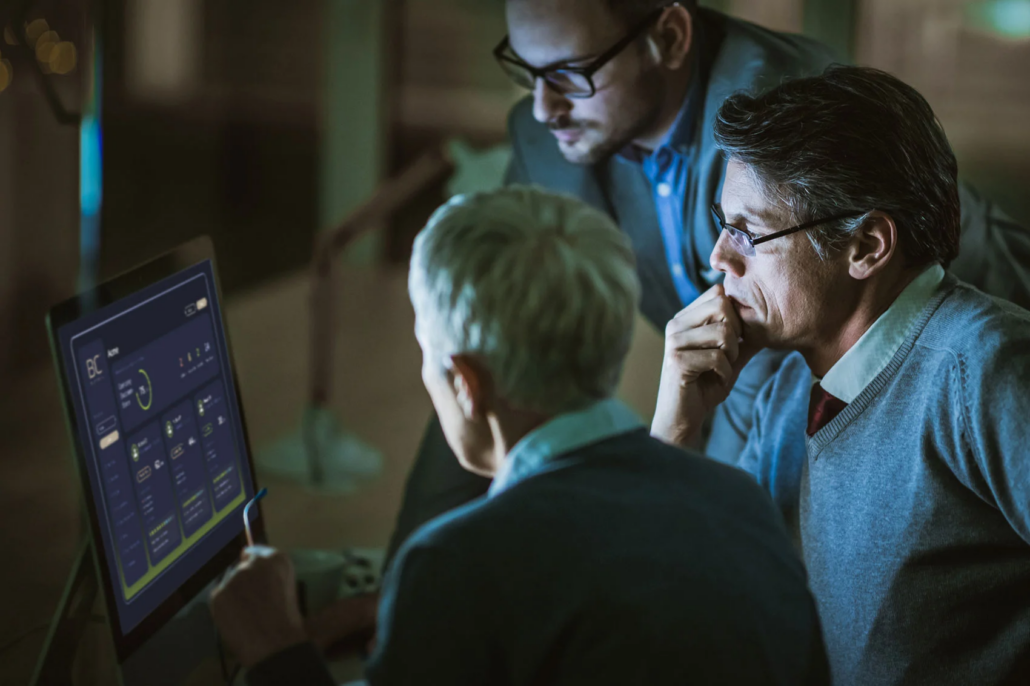 A security team reviewing the risk reduction dashboard together